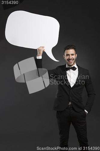 Image of Latino young man holding a speach balloon