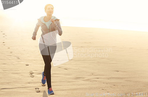 Image of Beautiful woman running