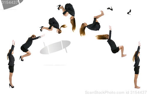 Image of Business woman making  a front flip