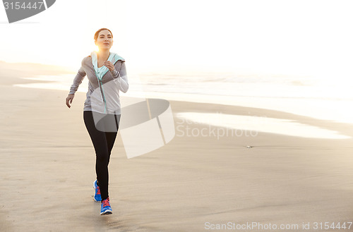 Image of Beautiful woman running