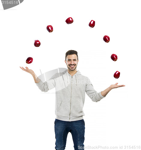 Image of Happy man juggling with apples 