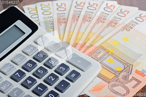 Image of Calculator and banknotes on the table