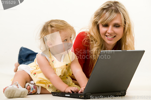 Image of Mom and baby with laptop