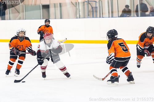 Image of Game between children ice-hockey teams