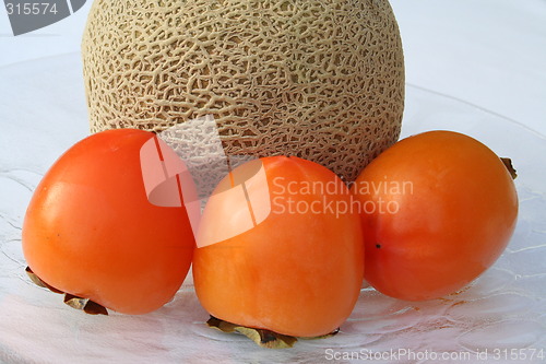 Image of Cantaloupe melon and persimmon