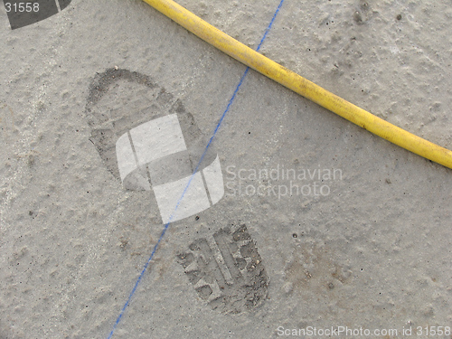 Image of Footprint in wet concrete