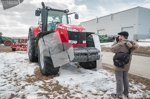 Image of Photographer shoots tractor on exhibition