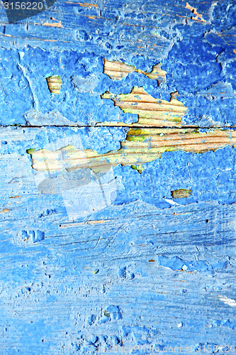 Image of nail stripped   in the blue wood and rusty 