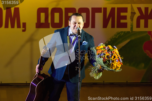 Image of Igor Sarukhanov with a flowers