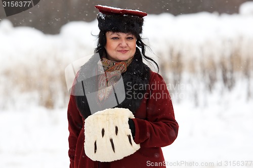 Image of Retro dressed woman posing