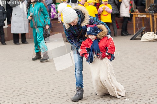 Image of Mother helps run