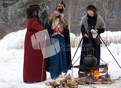 Image of Three women near the fire