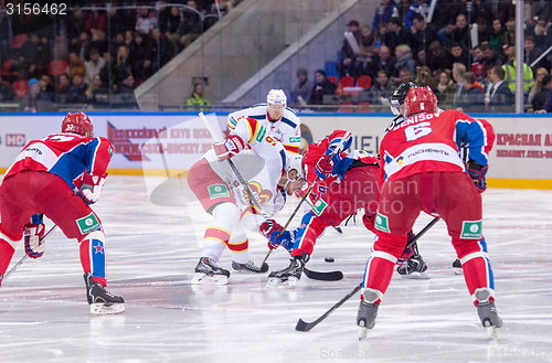 Image of P. Virtanen (26) and D. Denisov on faceoff