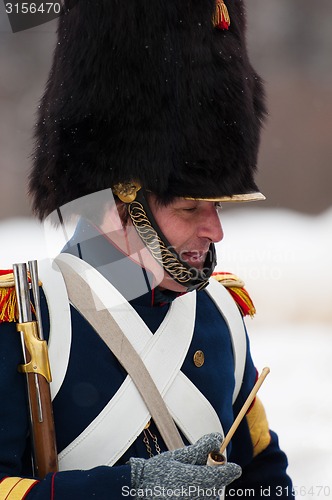 Image of Smoking russian musketeer with pipe