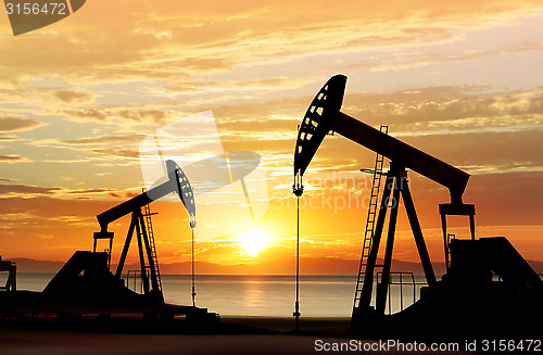 Image of silhouette of oil pumps
