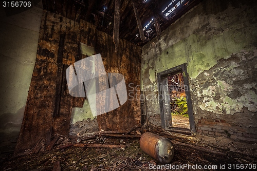 Image of Dark room interior with damaged roof