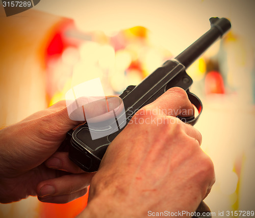 Image of Luger Parabellum automatic pistol in a hands