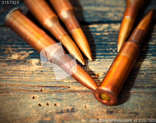 Image of Still life with five rifle cartridges