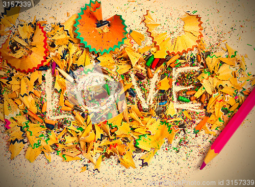 Image of word Love over a shavings of pencils