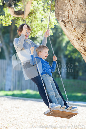 Image of family at swings