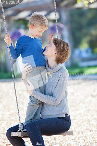 Image of family at swings