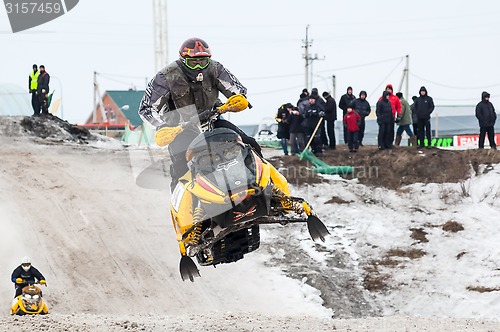 Image of Jump of sportsman on snowmobile