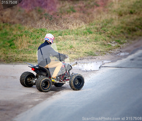 Image of Young man on a quad