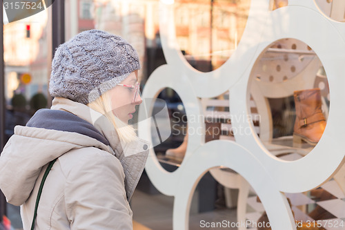 Image of Woman window shopping.