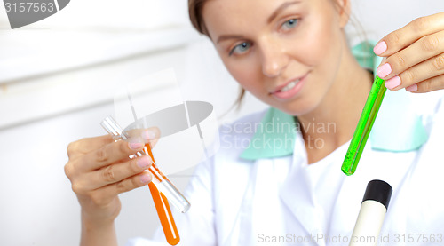 Image of pretty doctor examining contents