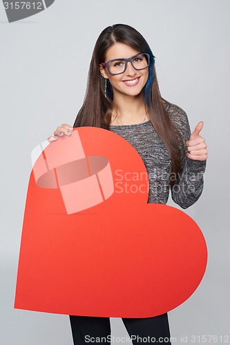 Image of Woman holding big heart shape