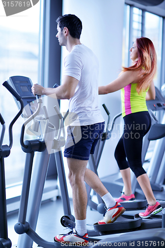 Image of Group of people running on treadmills