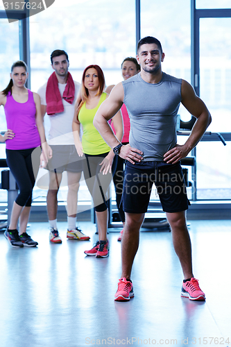 Image of Group of people exercising at the gym