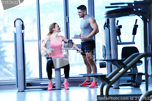 Image of woman exercising with her personal trainer