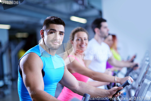 Image of Group of people running on treadmills