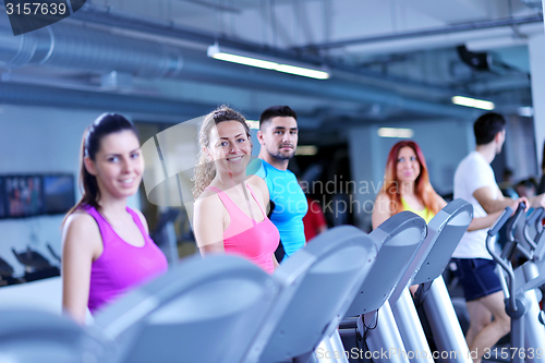 Image of Group of people running on treadmills