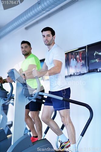 Image of Group of people running on treadmills