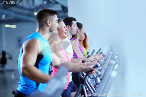 Image of Group of people running on treadmills