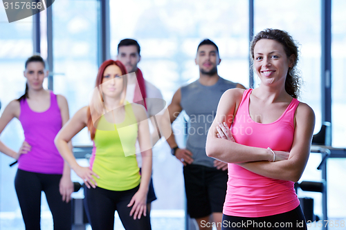 Image of Group of people exercising at the gym