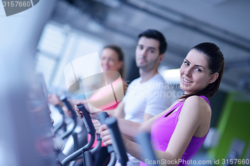 Image of Group of people running on treadmills