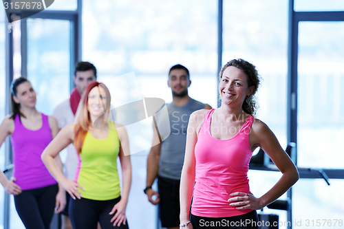 Image of Group of people exercising at the gym