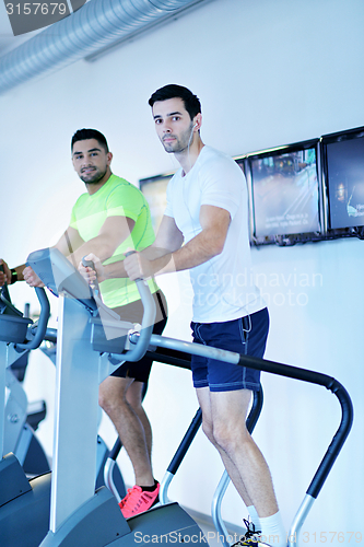 Image of Group of people running on treadmills