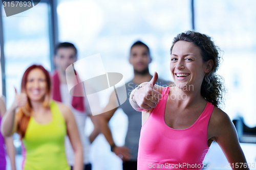 Image of Group of people exercising at the gym