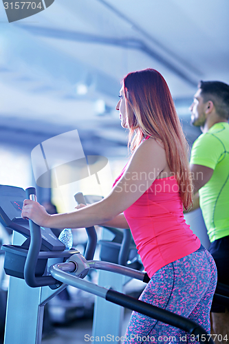 Image of Group of people running on treadmills