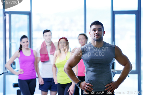 Image of Group of people exercising at the gym