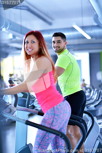 Image of Group of people running on treadmills