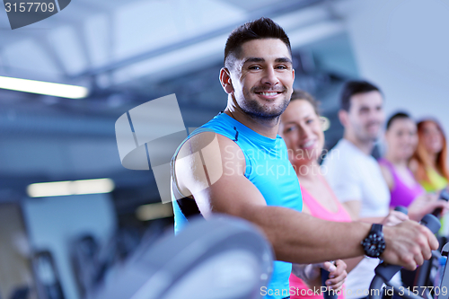 Image of Group of people running on treadmills