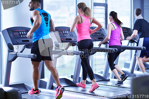 Image of Group of people running on treadmills