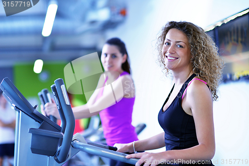 Image of Group of people running on treadmills