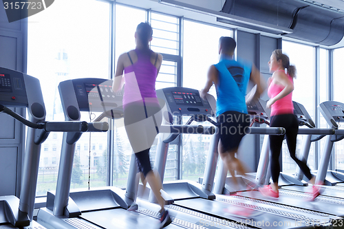 Image of Group of people running on treadmills