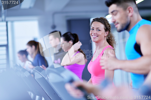Image of Group of people running on treadmills